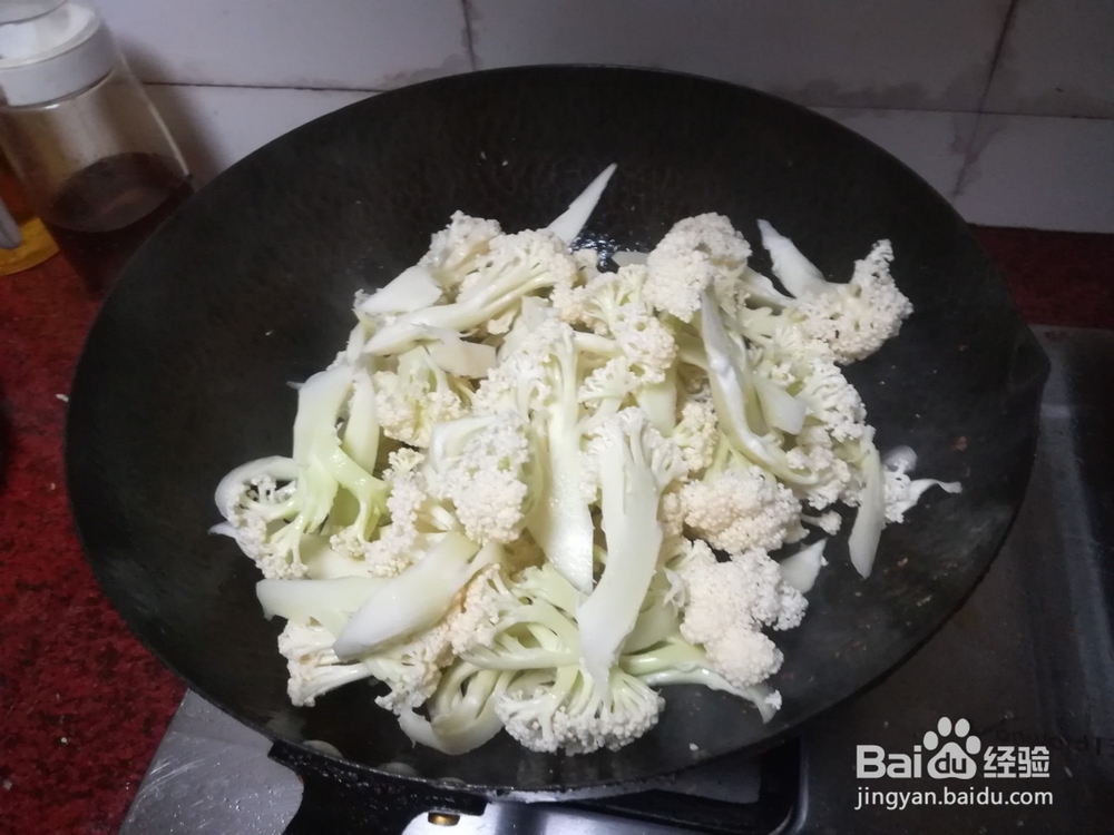 干煸腊肉菜花的做法