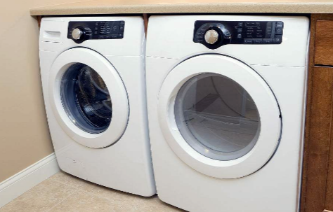 洗衣机洗衣服时转不动是什么原因