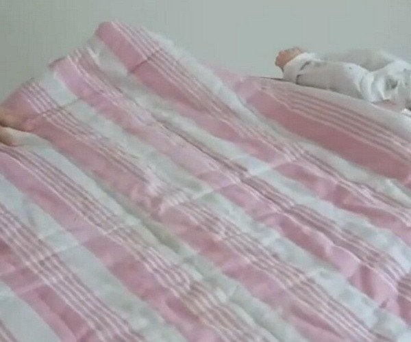 刚刚出生的婴儿怎么包图解