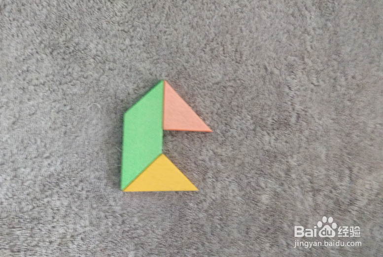 用七巧板怎样拼一个坐船尾的男士