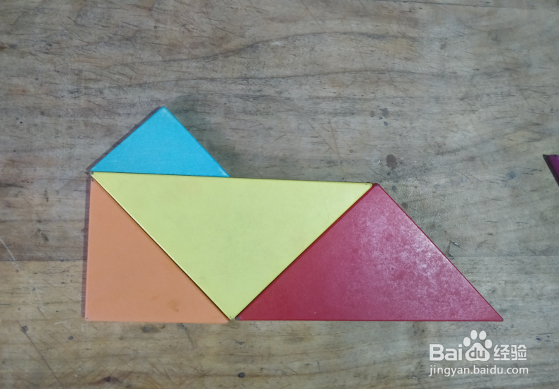 用七巧板怎样拼一座建在小岛上的房子？