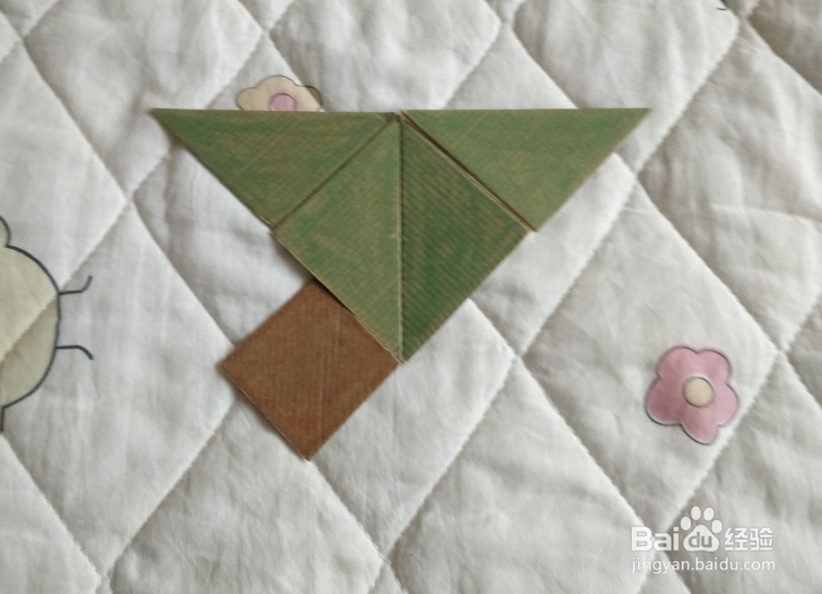 用九巧板怎么拼一个插花瓶呢