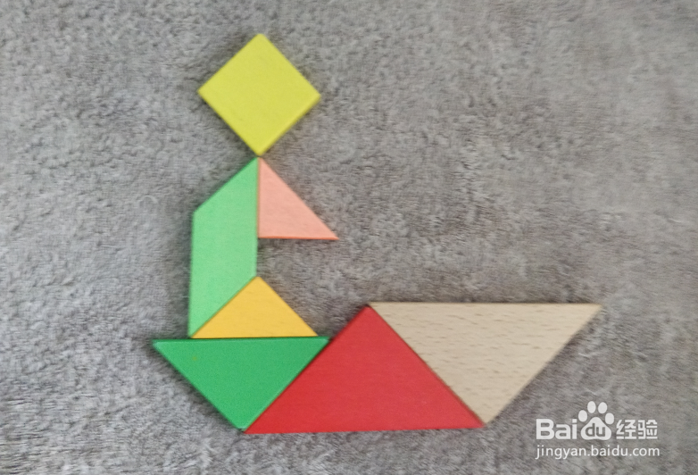 用七巧板怎样拼一个坐船尾的男士