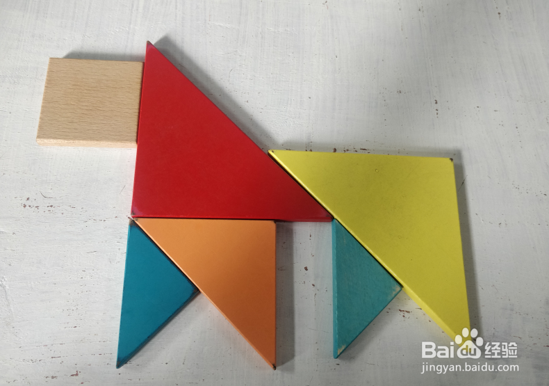 用七巧板怎样拼一只四脚挨地站着的猴子?