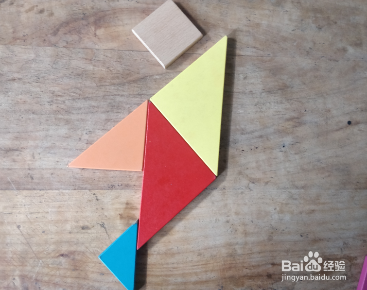 用七巧板怎样拼一个挥胳膊的小孩?