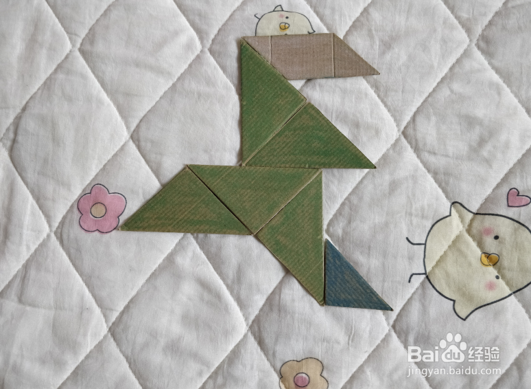 用九巧板怎么拼一个终点冲刺的小哥哥呢？