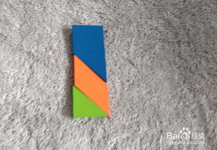 用九巧板拼图玩具怎样拼一只加长的打火机？