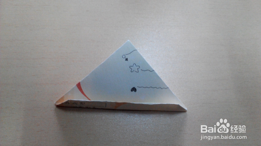 利用纸币或者折纸折一颗心的折法