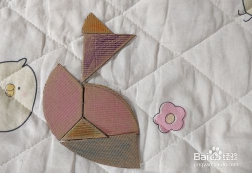 用蛋形九巧板怎么拼一只站着张望的鸟儿?