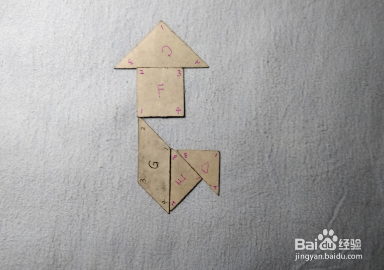 用七巧板怎样拼一个拿着手绢的女士?