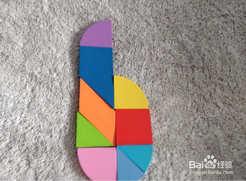 用九巧板拼图玩具怎样拼一只加长的打火机？