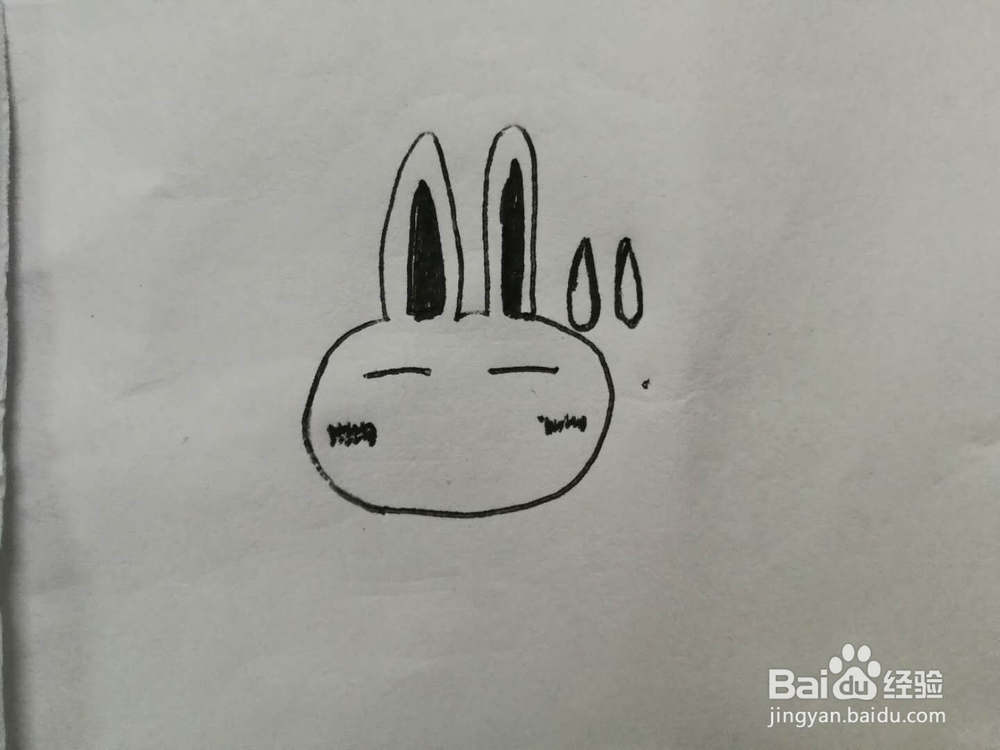 简笔画无奈的兔子