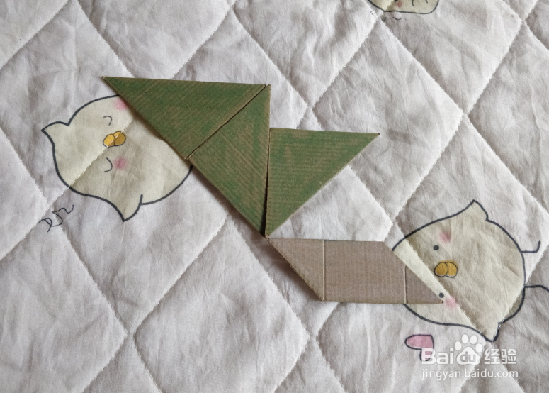 用九巧板怎么拼一个弹跳练习的小哥哥呢？